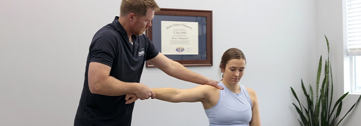 Chiropractor Ryan Griffeth With A Shoulder Pain Patient