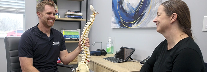 Chiropractor Ryan Griffeth With Spine Model