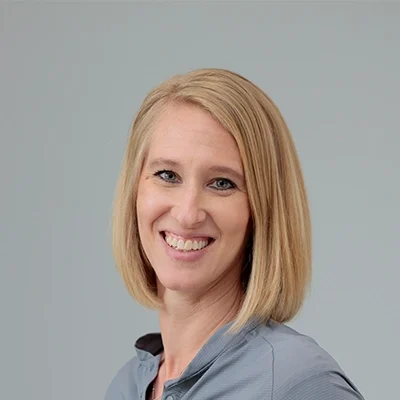 Kristin Griffeth Smiling In Grey Shirt