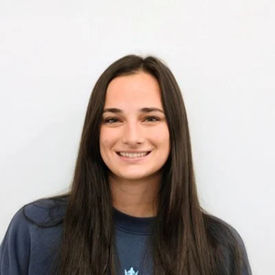 Member Coordinator Sydney Schmitt Smiling